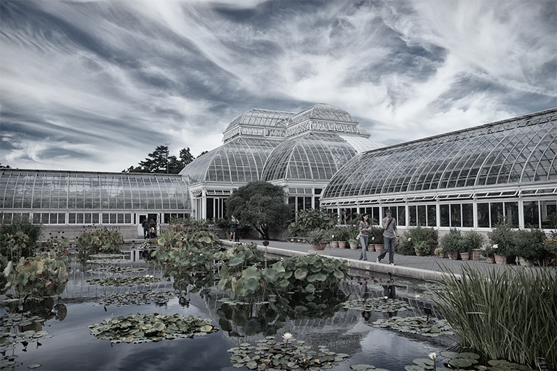 Garden Conservatory with walkway and pond.