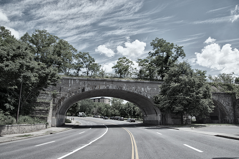 Yonkers overpass, trees and sky with wispy clouds.