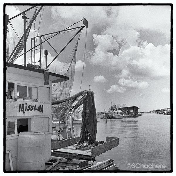 Boat named "Miss Lou" at marina