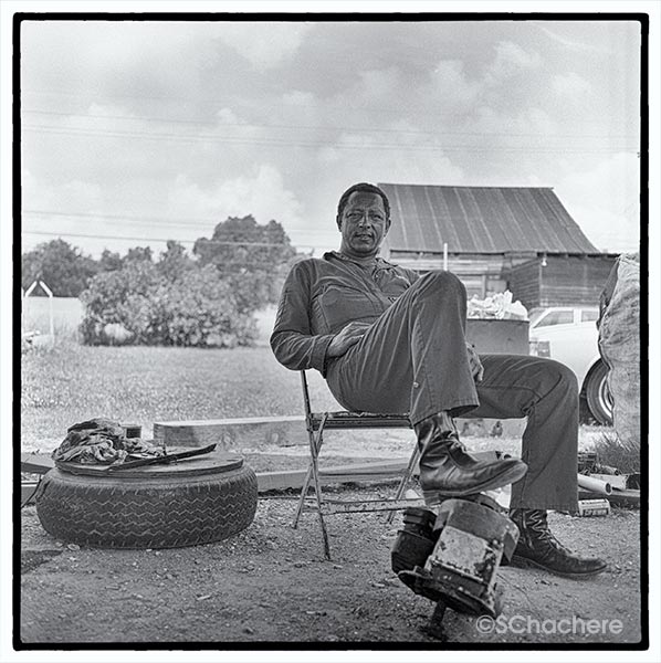 Man on folding chair.