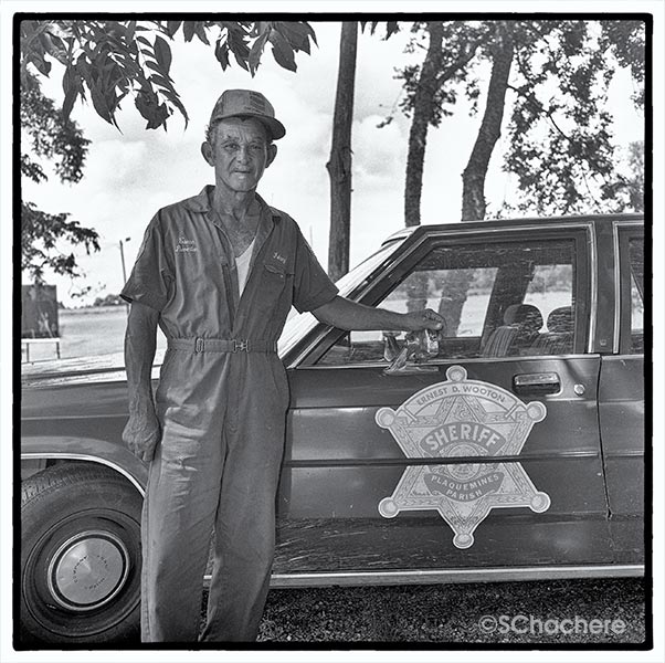 Man standing by vehicle