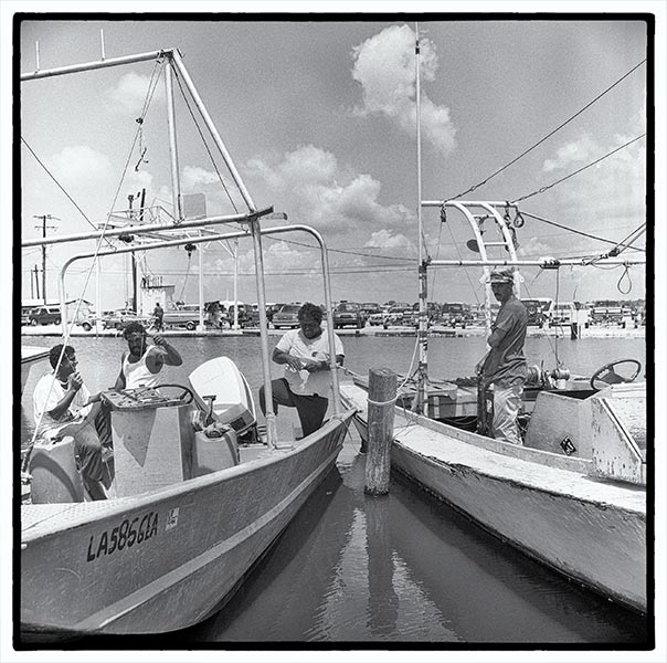 Men on Boats at Marina