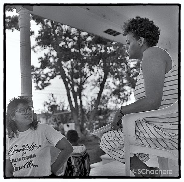 Two women sitting on porch