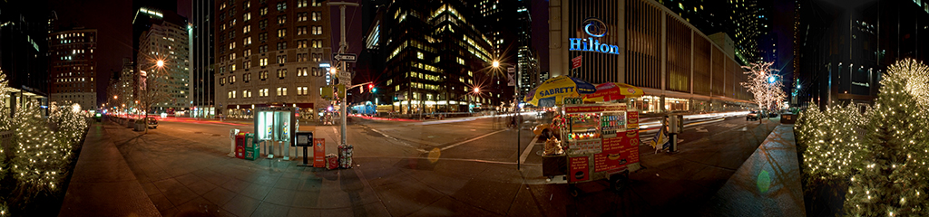 Panoramic view of 54th and 6th in New York City at night