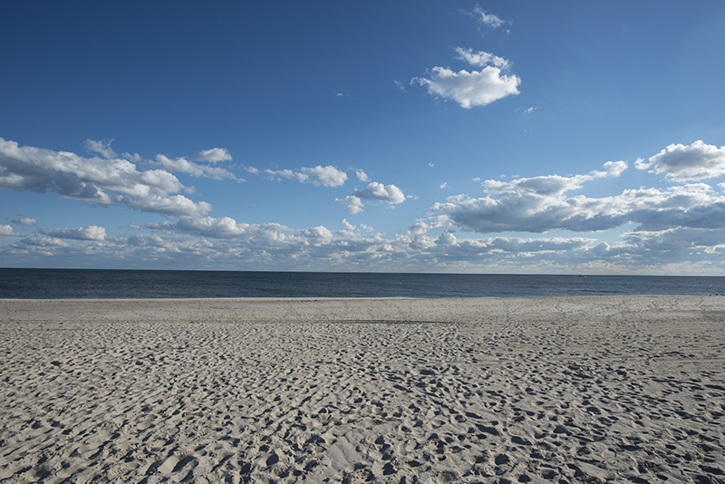 View of sand, sky and shoreline on Long Island
