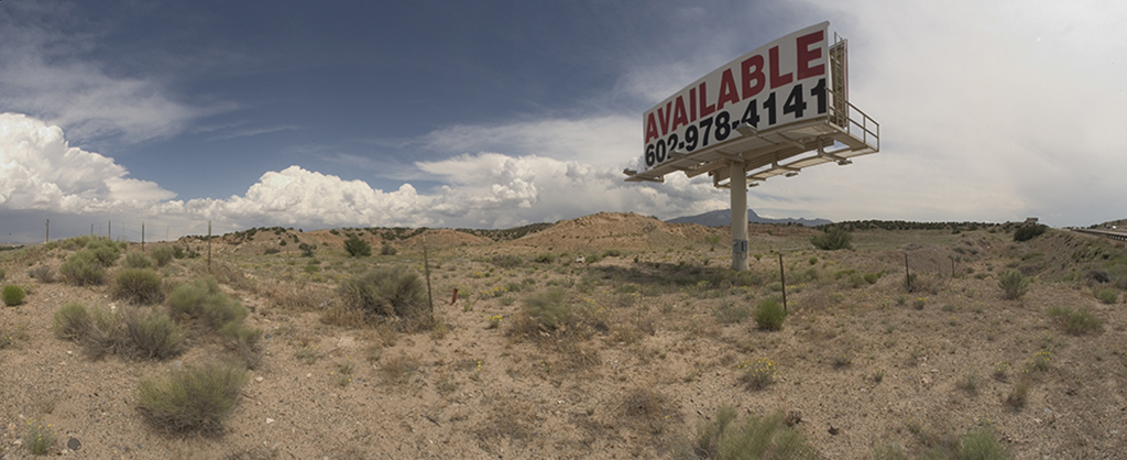 Panoramic view of New Mexico desert area and billboard
