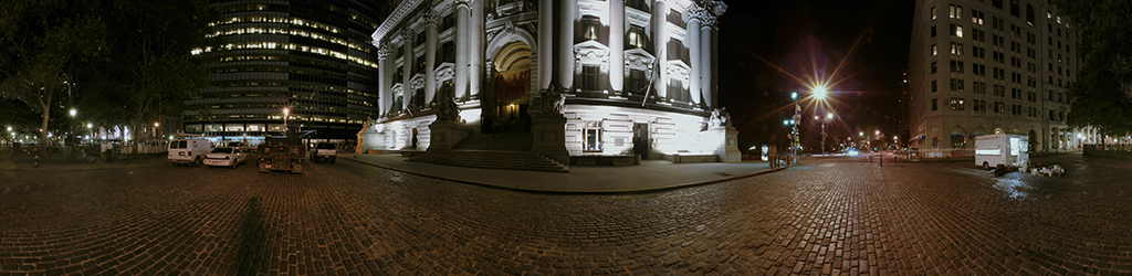 Panoramic view of Bowling Green and surrounding empty streets at night