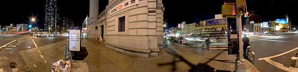 Panoramic view of Canal Street, New York City, at night