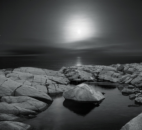 Light over rocky shore line