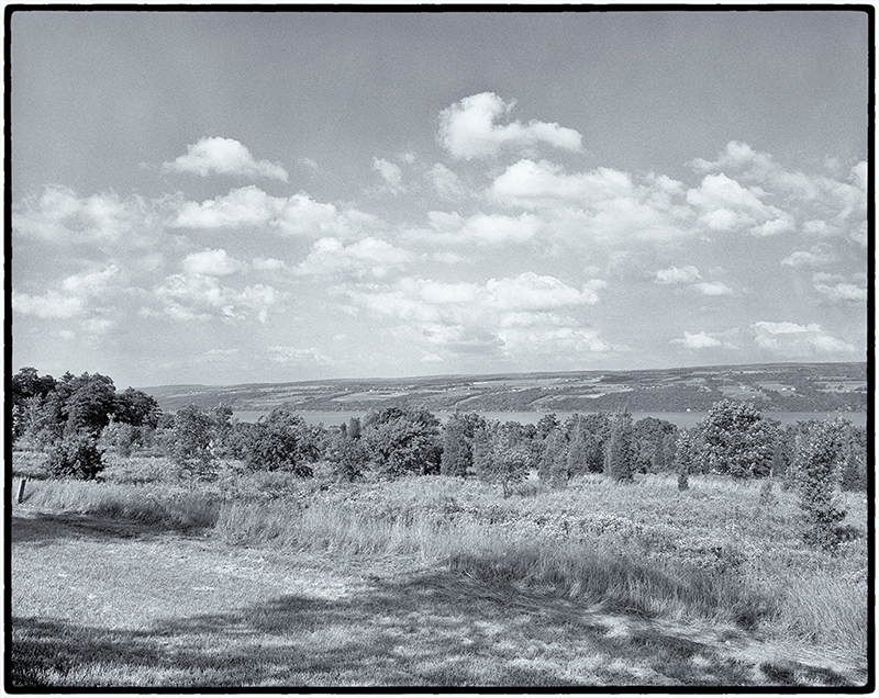Vista of clouds, sky, hills and river
